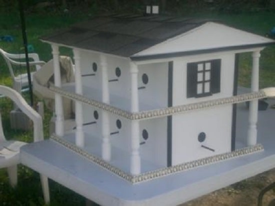 Birdhouse built like a mansion house for wife's grandmother